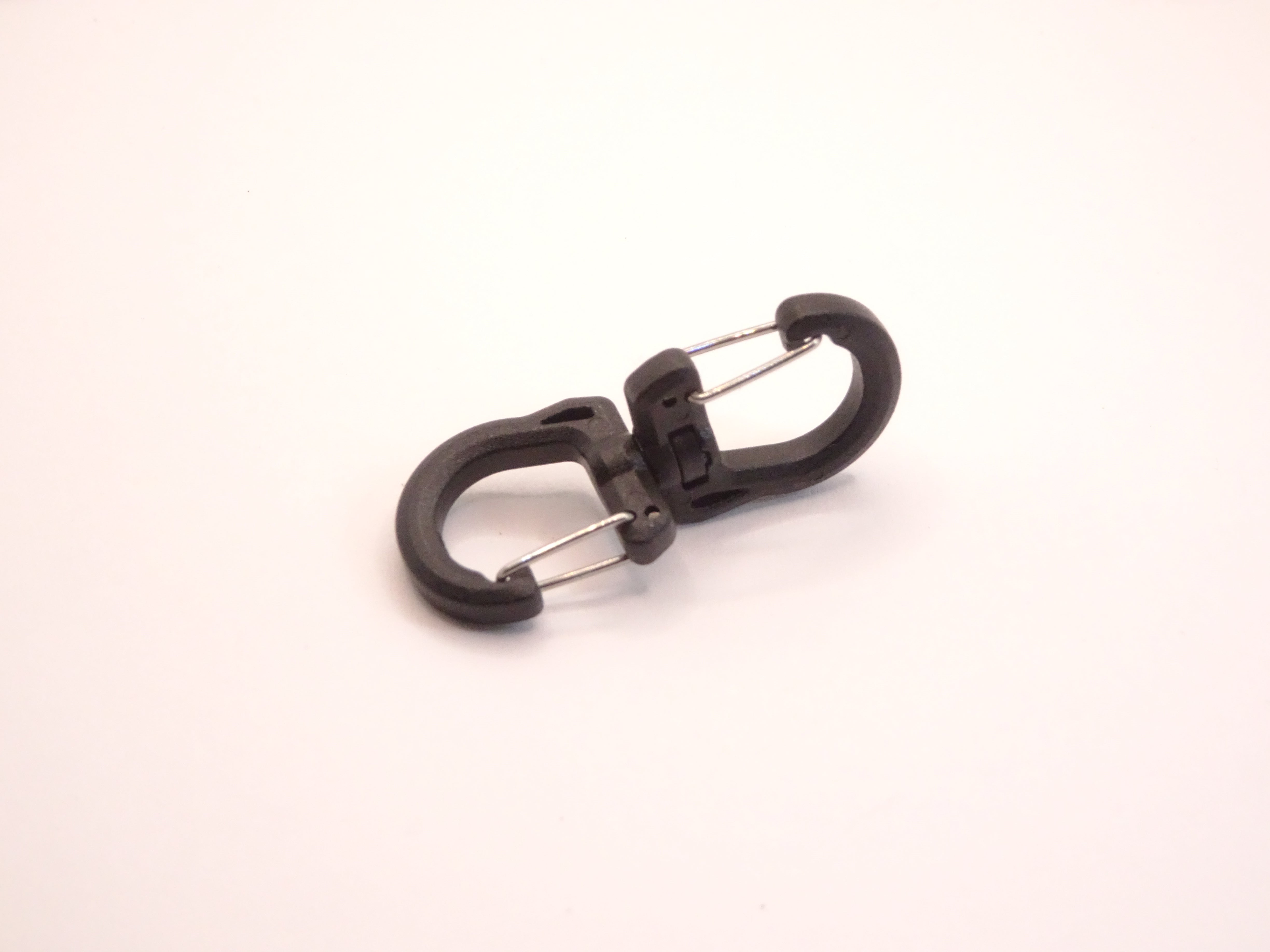 Mozet Supplies' double carabiner joined in the middle by a swivel point. Available in Small, Medium, and Large and in a variety of colors. Intended to secure lighter weight items and comes in a number of colors! These are the same type as the ones from Tom Bihn!