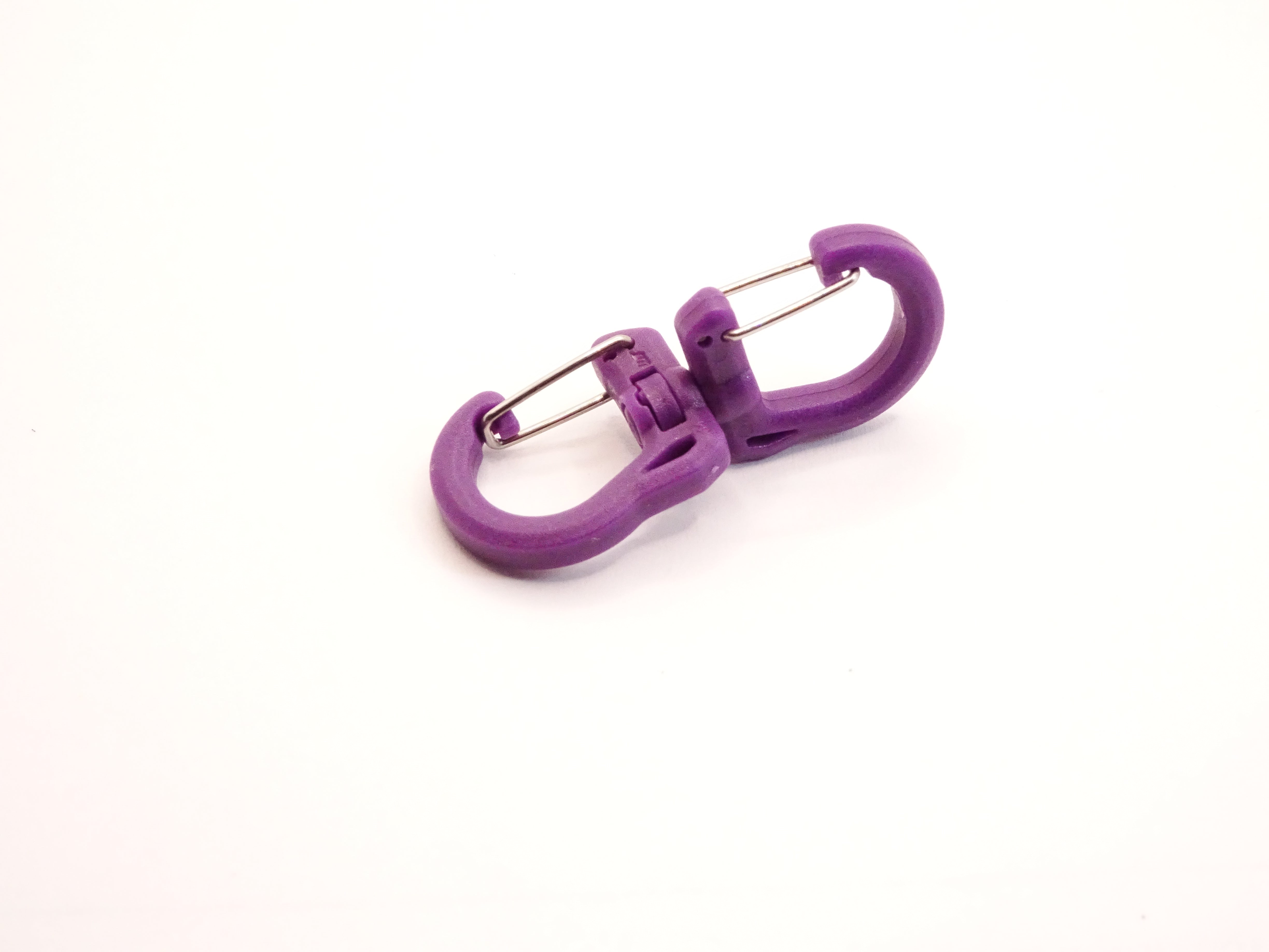 Mozet Supplies' double carabiner joined in the middle by a swivel point. Available in Small, Medium, and Large and in a variety of colors. Intended to secure lighter weight items and comes in a number of colors! These are the same type as the ones from Tom Bihn!