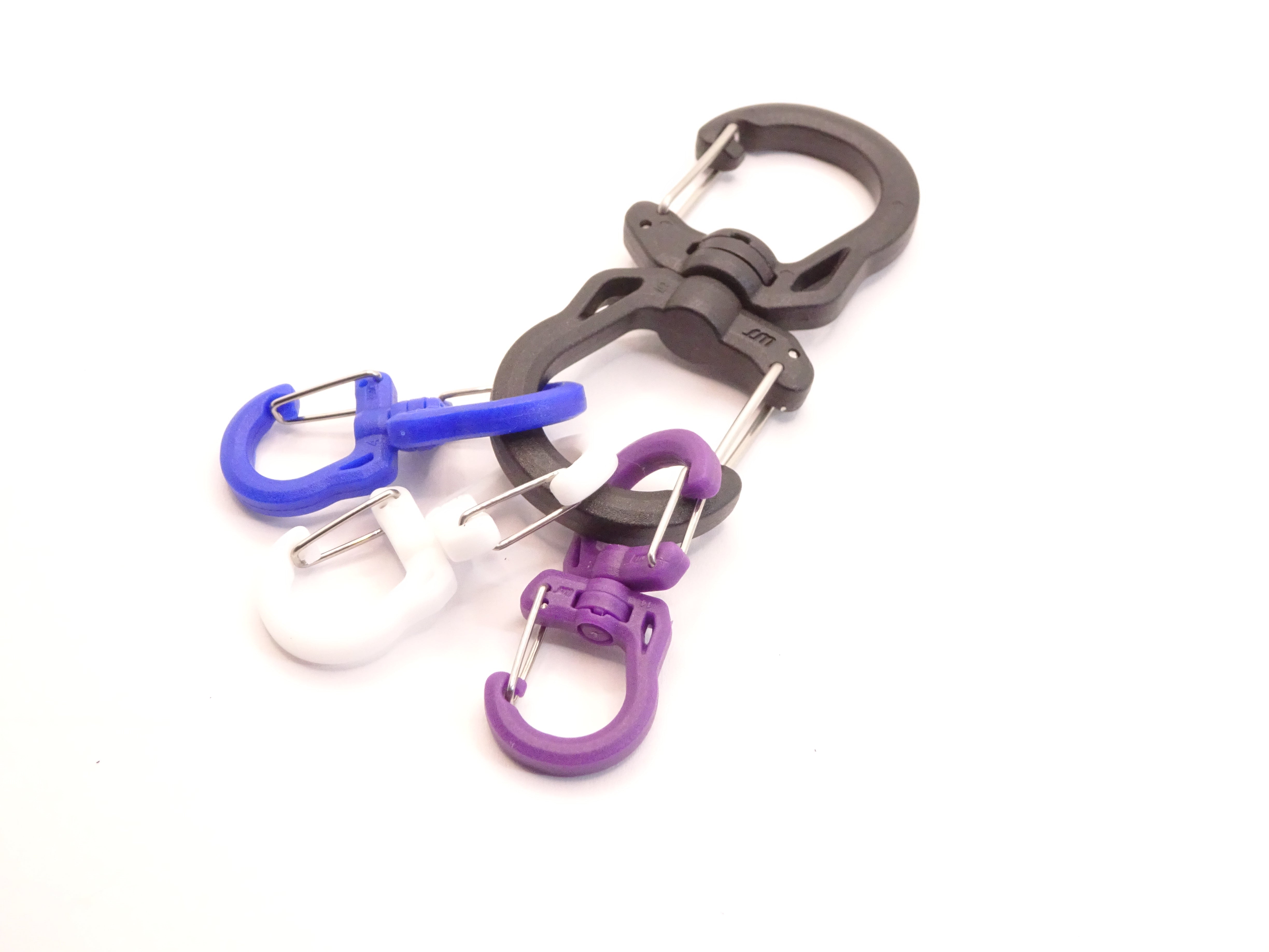 Mozet Supplies' double carabiner joined in the middle by a swivel point. Available in Small, Medium, and Large and in a variety of colors. Intended to secure lighter weight items and attach to backpacks. These are the same type as the ones from Tom Bihn!