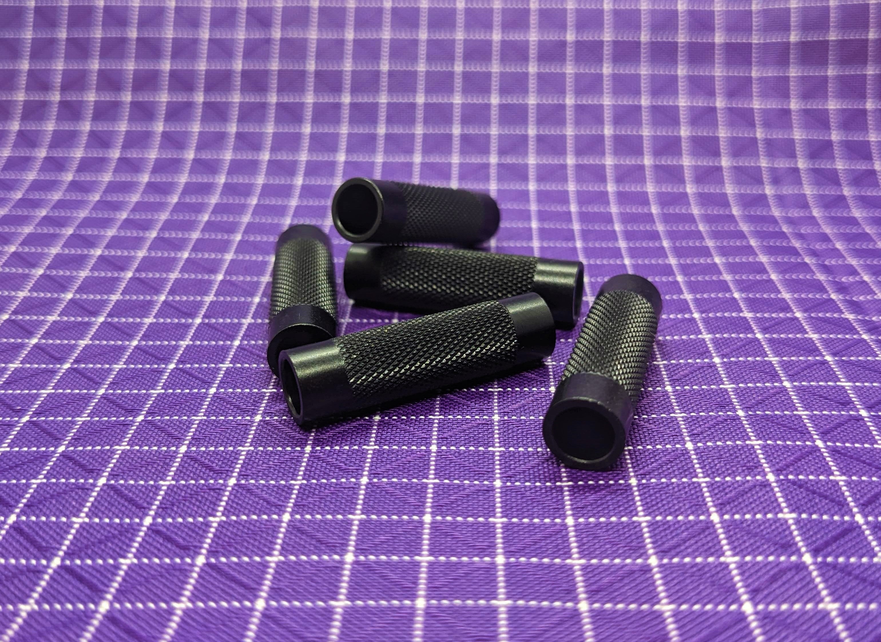 This Knurling Al-Pul is used to add a grip to a zipper pull. Tie these onto the zipper slider with cord and it gives you an easy pull to grab onto. It is also aesthetically pleasing!