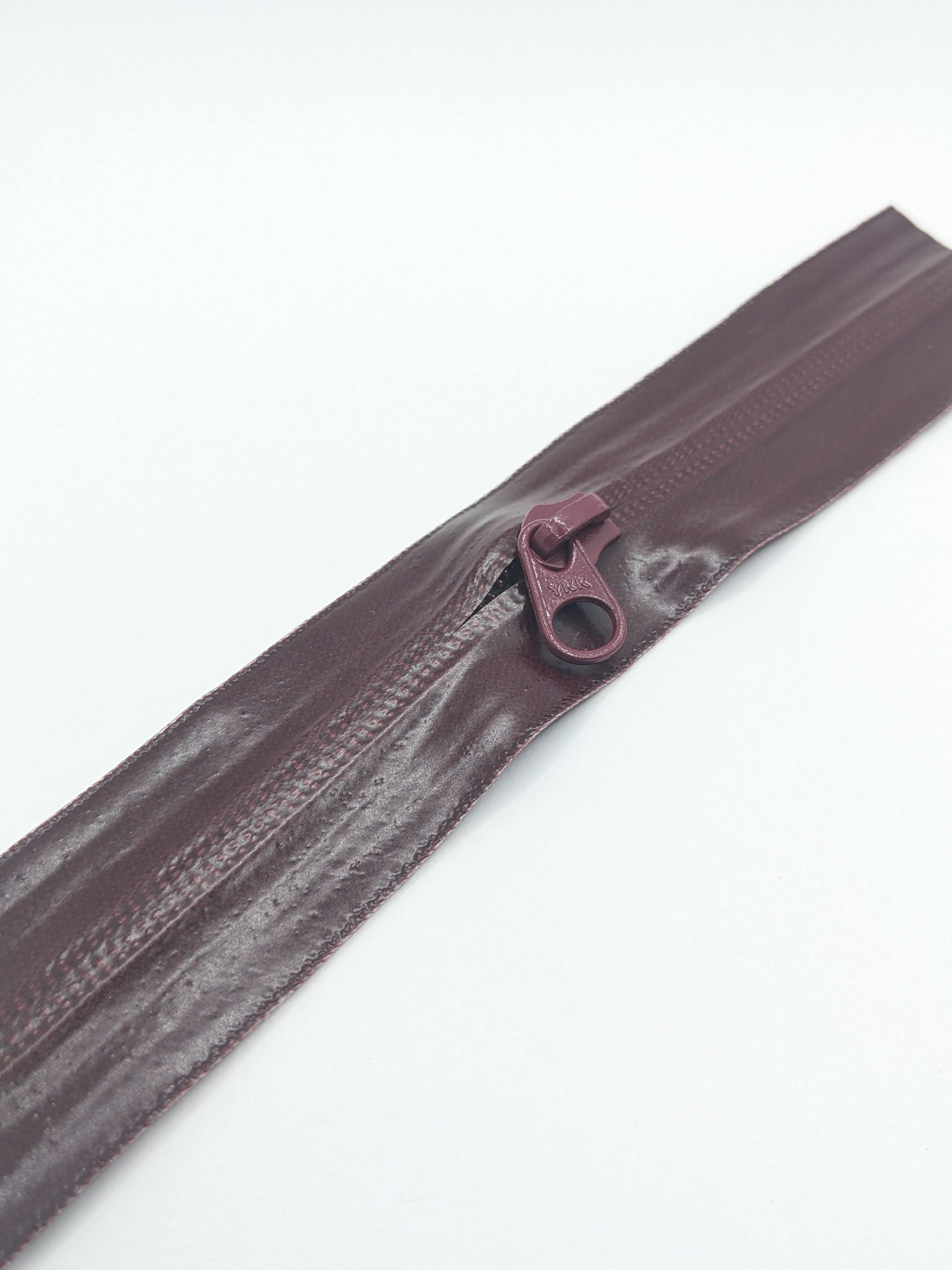 YKK's AquaGuard® NATULON® series is an eco-friendly water-repellent zipper option created by laminating polyurethane (PU) on the non-coil, reverse side of a zipper. The NATULON style is the new sustainable standard for all YKK Aquaguard products. YKK's AquaGuard® NATULON® updates include: Recycled polyester tape (which helps reduce CHG emissions) PFC free water repellant finish 20-40% smoother in operation force New smoother appearance