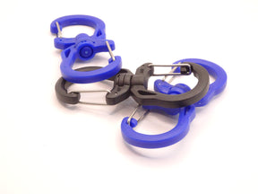 Mozet Supplies' double carabiner joined in the middle by a swivel point. Available in Small, Medium, and Large and in a variety of colors. Intended to secure lighter weight items and attach to backpacks. These are the same type as the ones from Tom Bihn!