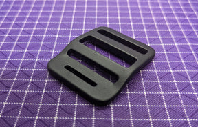 This is a high-quality, aluminum strap adjuster that is perfect for using with backpack straps. The aluminum is both strong and light!