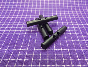 Aluminum WeTOOL Toggle that can be secured using cord and used with backpacks, tents, bags, and more! Use this when making your own gear!